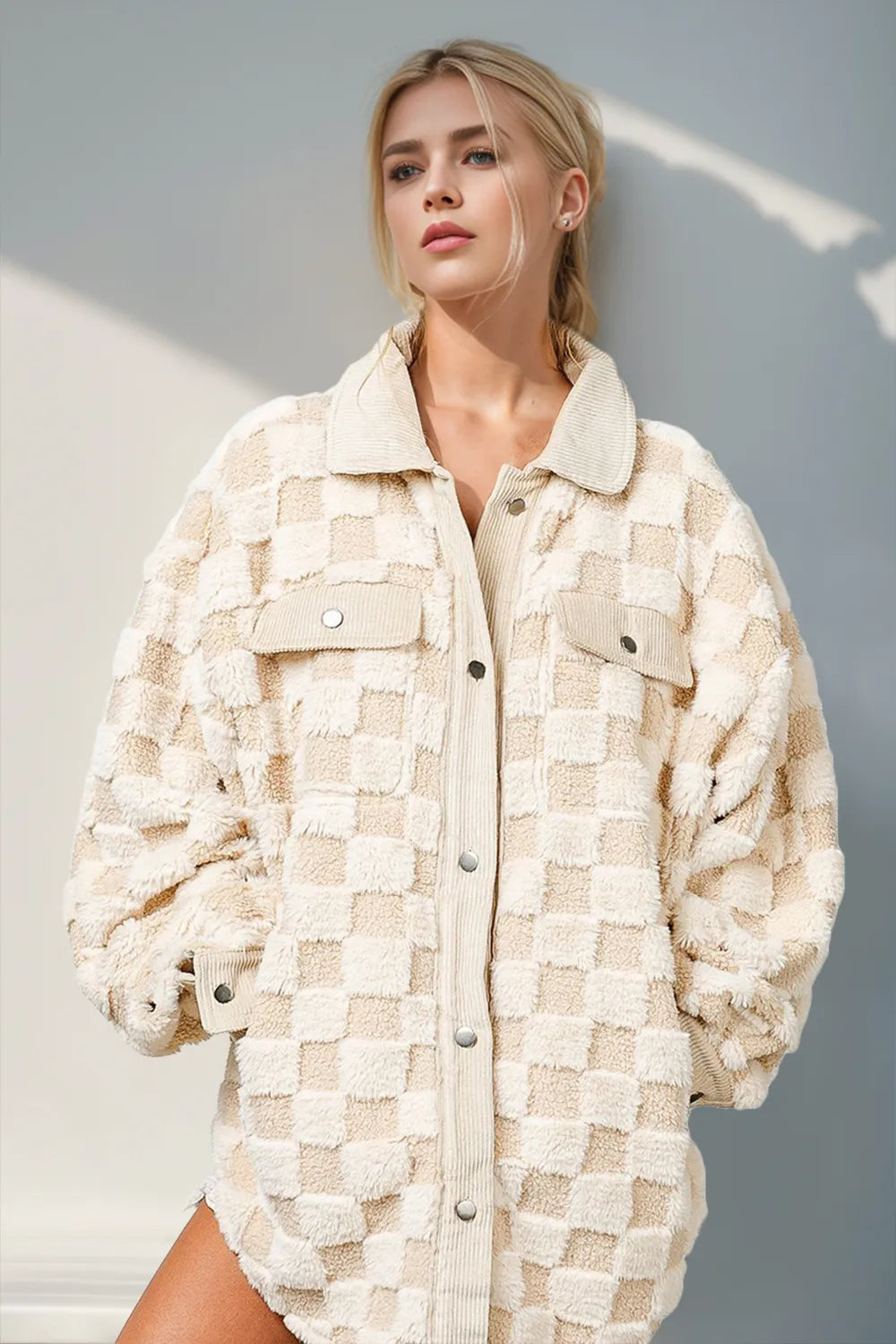 Model styled in a plush checkered shacket jacket for fall streetwear look